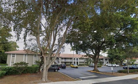 Photo of 11213 Royal Palm Blvd #11213, Coral Springs, FL 33065 (MLS # A11874782)