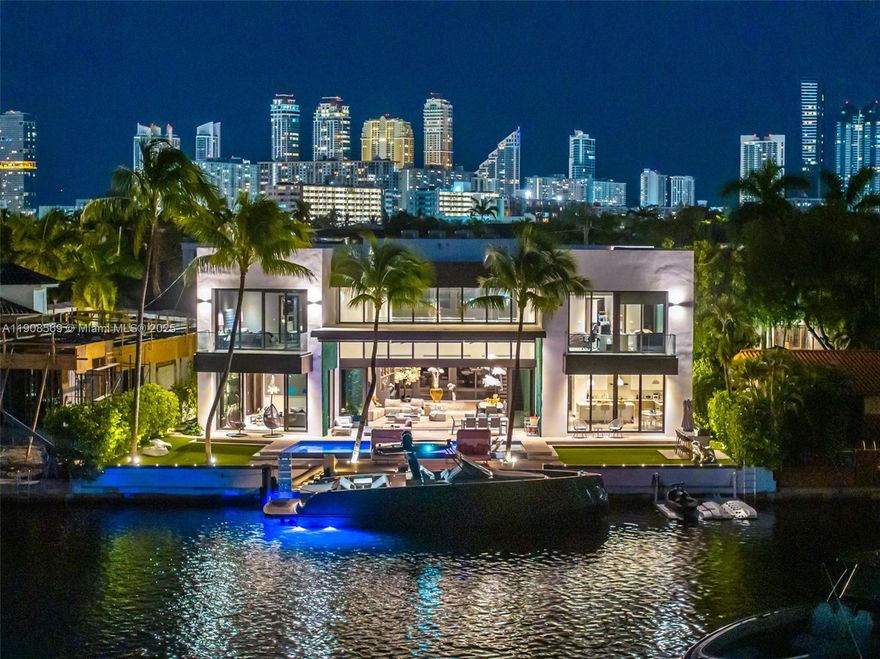 Located in exclusive gated neighborhood of Eastern Shores, perfectly positioned between Aventura, Sunny Isles, and Bal Harbour, this newly built modern masterpiece captures one of the rare wide-open views of Maule Lake. Soaring ceilings and a full wall of glass draw the water straight into the living space, while 100 feet of waterfront provides prime dockage in a calm no-wake zone. The private backyard and peaceful setting make it ideal for quiet luxury living, with ocean access in under ten minutes. Featuring a top-of-the-line Italian chef’s kitchen and fully built-out closets, this is Eastern Shores at its best.