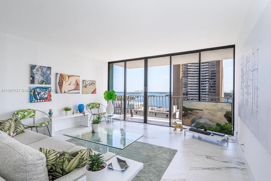 Enjoy gorgeous panoramic bay and downtown views from all rooms and balcony. Lovely updated 2 bedroom 2 bathroom condo. Split bedroom plan, light and airy,  white and grey marble floors, renovated kitchen with pantry, and new dishwasher, updated bathrooms, and new custom blackout blinds in bedrooms.  Assigned and valet parking , full service building, 24 hour doorman, gated entry, and gym. in Competitively priced because building is currently undergoing renovations of pool, tennis courts , and parking. Convenient location steps to waterfront Baywood Park, and fabulous MIMO District restaurants, cafes, shops, and Legion Park green market and yoga.