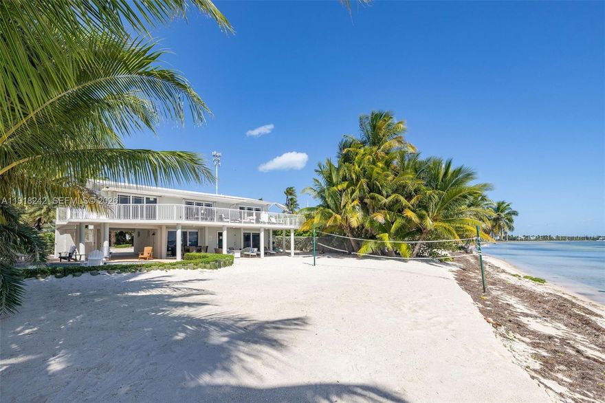 Incredible opportunity to own an amazing large home directly on the ocean in the Florida Keys, Islamorada. Use this property or rent it with significant short term rental income in demand all year round.  A huge 21,600 sft lot has pool, sports area, bbq area, storage, and plenty of gated parking. Home is 2,500+sft. The tranquility of this charming area and private street make this home the perfect Keys gateway.  Vastly upgraded, this house has a full kitchen on each floor, 3 sizeable bedrooms with ocean views and 2 baths upstairs, and a huge bedroom suite with ocean views and bath and another cabana bath downstairs.  Multiple dining and living areas, a play area and of course a large sunny deck with views upstairs and a massive covered patio downstairs.  Play beach volleyball on the ocean, or take a dip in your pool facing the ocean.  Room for all your water toys as well as bbq area and plenty of parking.  This is a once in a lifetime chance to own hugely desired direct ocean waterfront.  Call us today to make an appointment to tour this beach compound.