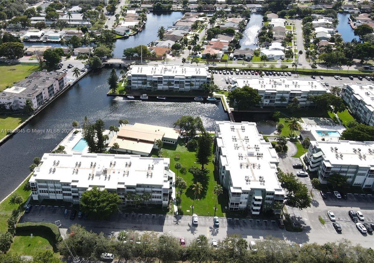 Spacious condo with natural light located in a peaceful community. This home features a large living and dining area, a generously sized bedroom with a walk-in closet. The enclosed balcony has been seamlessly incorporated into the living space, making it ideal for a home office or an additional guest room. Conveniently located just minutes from the I-95, beaches, Fort Lauderdale Airport, shopping centers, and Hollywood’s dining district.