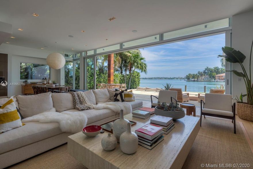 On Venetian Islands, sits this exquisitely designed architectural, custom home. A model of sophistication, it showcases unprecedented European craftsmanship and bespoke details which elevate the property to a true work of art. This Tropical modern home offers an open floor plan with Floor to Ceiling sliding doors that seamlessly integrate the indoor and outdoor spaces for the ultimate Florida lifestyle. The main level consists of living and dining rooms, kitchen with Miele appliances, family room, and an en-suite bedroom or office.The upper level holds four ensuite bedrooms including an opulent master suite with large closet, luxurious master bathroom, and designer fixtures and finishes. The outdoor area contains a large pool with a covered BBQ and outdoor shower.