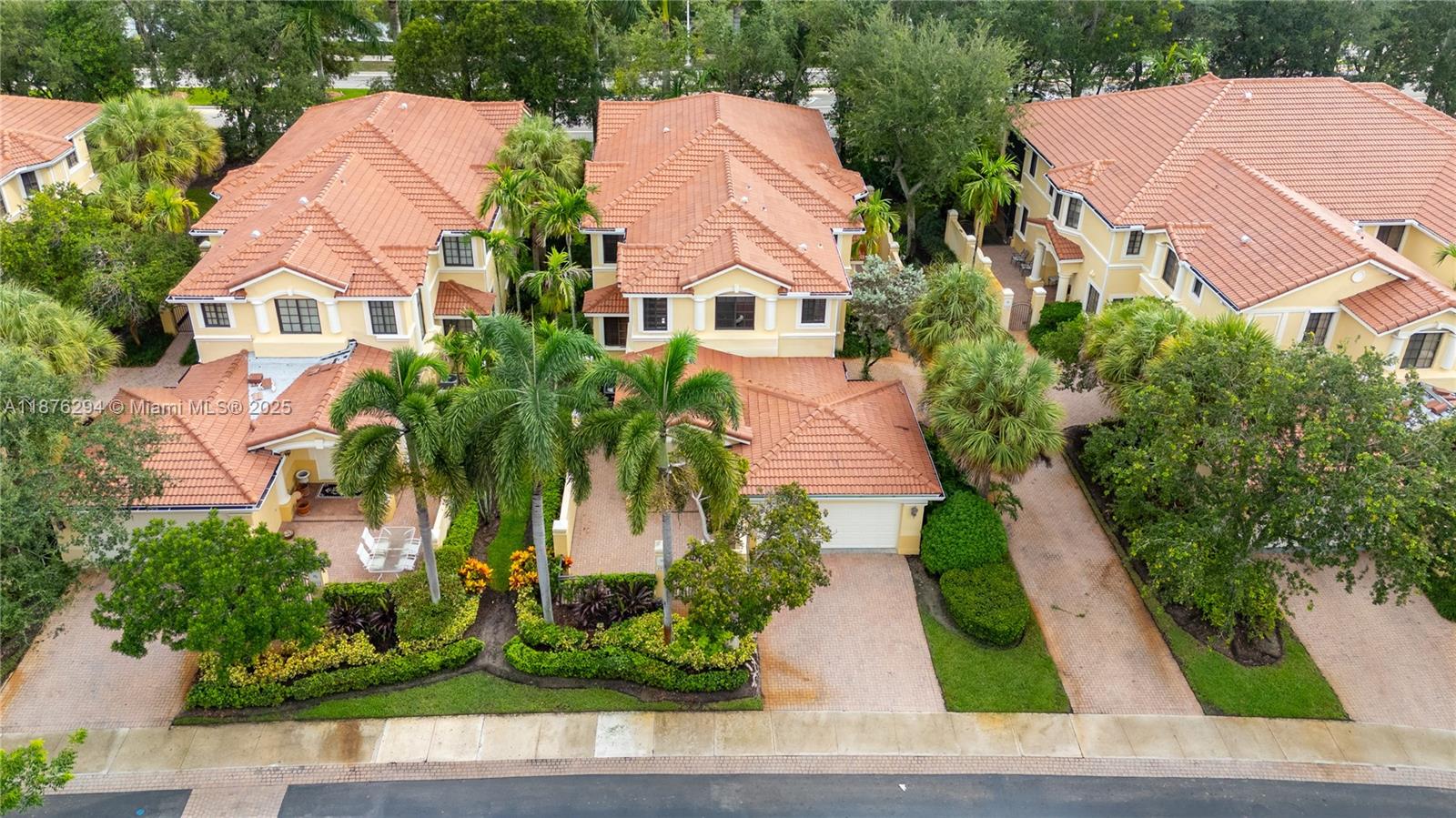 Spacious coach home at the gated, small private enclave of Mariposa Pointe, combining comfort, convenience, and privacy in a beautiful setting. Featuring a Brand New Roof, private courtyard entry, bright and functional layout with 3 bedrooms, 2.5 bathrooms, laundry room, and large screened balcony. Highlights include impact windows and doors, tile and wood floors, a large kitchen with quartz counters, en-suite primary bath, and a generous walk-in closet. Electric chair lift & energy-saving, tankless water heater. Enjoy worry-free living with association services covering landscaping, painting, roof, insurance, and security. Just a short walk to Town Center shops and minutes from schools and highways.