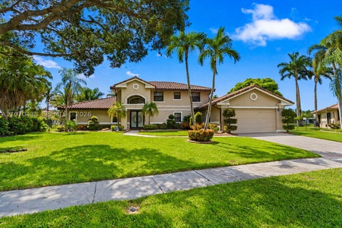 Photo of 451 NW 194th Ave, Pembroke Pines, FL 33029 (MLS # A12070438)