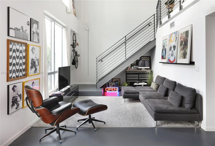 Fully furnished and decorated, this 1060+SF, loft-style comes also equipped. Full of light, provides an open layout, offering on the first level, an open kitchen, balcony, 1/2 bath, floor-to-ceiling windows, and spacious living room area. You will find the 2nd floor is an open concept set up with 2 beds each with its separate designated spaces and closets (1 walking closet) and a full bathroom. Balcony on each level. 1 convenient covered parking spot only a few steps away from the unit, you will barely use the elevator. Main lobby with 24 hrs. Located on the North view of 25th st, the sun will never hit your windows directly which allows you to enjoy the whole loft through the day. The building has a sauna, Gym, infinity pool, jacuzzi, and more.