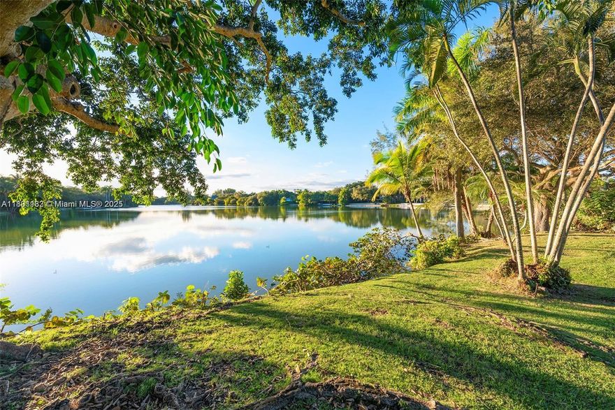 Seize the rare opportunity to craft your lakefront sanctuary in prestigious, gated Hammock Lakes. Nestled on a lush acre, this prime lot and residence promise breathtaking sunset vistas. Expand and enhance the existing Mid Century single-story home, distinguished by high ceilings in open, glass walled living spaces, or envision and build your own masterpiece from the ground up. Situated in one of Coral Gables’ most desirable neighborhoods, this property delivers unmatched potential to transform your dreams into reality. Experience the tranquility and remarkable appeal of this sought-after lakeside location. Property is in a Miami-Dade Special Taxing District.