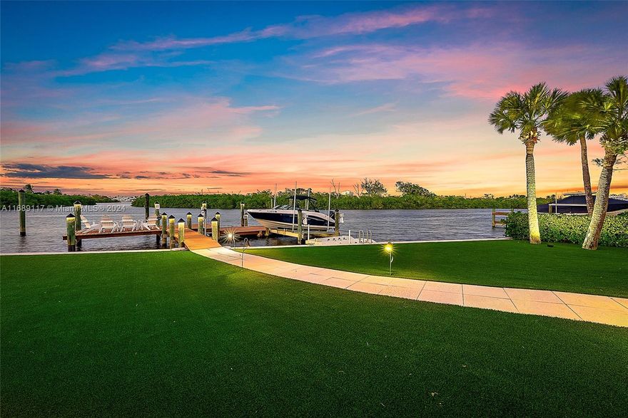 This rare .85-acre waterfront property in the heart of Jupiter is a true gem. With stunning views of a serene bird sanctuary, this estate offers a peaceful and private retreat. Boating enthusiasts will appreciate the spacious backyard, with the ability to accommodate large vessels, 12,000 pound boat lift, and easy access to the ocean with no fixed bridges. You're just minutes away by boat or car, to some of Jupiter's finest restaurants, offering a vibrant dining scene. The long, beautifully landscaped driveway adds to the charm, creating a grand entrance to this exceptional residence. A waterfront estate in Jupiter like this is an incredibly rare opportunity.