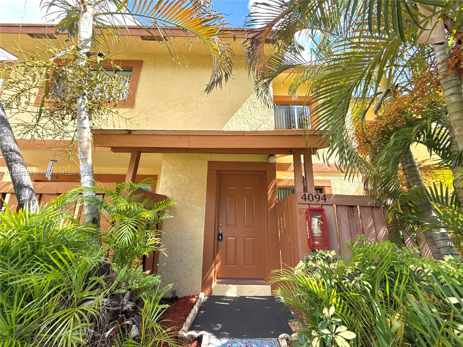 2BR/1.5BA lake view townhouse with screened private backyard. It features a half bathroom on the ground floor, spacious closet space, and an in-unit washer and dryer. 2 Assigned Parking