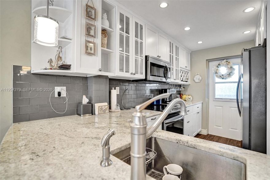 Experience refined coastal living in this beautifully 2-bedroom, 2-bathroom residence offering 1,225 sq ft of thoughtfully designed space. This elegant condo is less than a mile from the beach, just an easy under-20-minute stroll to pristine sand and ocean breezes. Featuring a spacious, open layout filled with natural light and a sophisticated coastal ambiance. Generously sized bedrooms provide comfort and privacy, while the convenience of an in-unit washer and dryer enhances everyday living. Ideal as a primary residence or upscale beach retreat, this home is perfectly positioned near premier dining, shopping, and entertainment in the heart of Deerfield Beach.