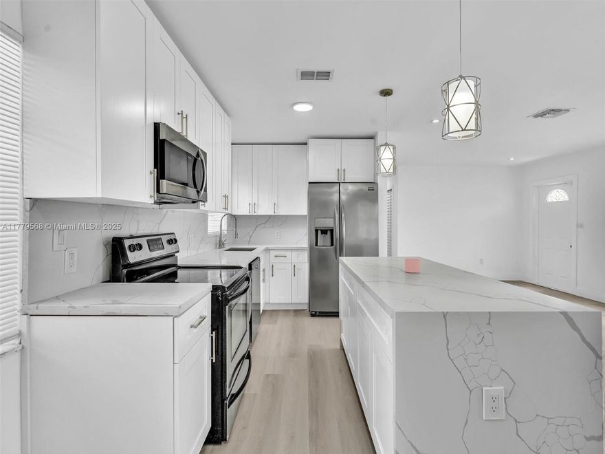 BACK ON MARKET! This beautifully upgraded 4-bed, 2-bath home is a true gem. Boasting a brand-new roof, new AC, and a stunning kitchen with a waterfall island, it’s designed for modern living. The open floor plan flows effortlessly, featuring luxury vinyl flooring and a seamless color palette that enhances the home's inviting atmosphere. Perfectly situated in a community with excellent schools, parks, and shopping, and just minutes from downtown Fort Lauderdale and the beach. A move-in ready home that combines comfort, style, and convenience—don’t miss it!