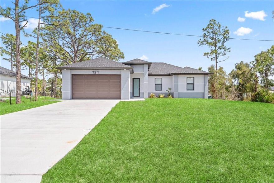 Experience the best of new construction in a flourishing area of Lehigh Acres! This stunning 3-bedroom, 2-bathroom home features a bright and airy open-concept kitchen, perfect for entertaining. The kitchen boasts elegant wood cabinets, pristine quartz countertops, and a full suite of brand-new stainless steel appliances. Enjoy the Florida sunshine and ultimate peace of mind with impact windows and doors throughout. With gorgeous porcelain tile underfoot and zero updates needed, this move-in-ready home offers the perfect blend of modern style and effortless living. Schedule your private showing today!