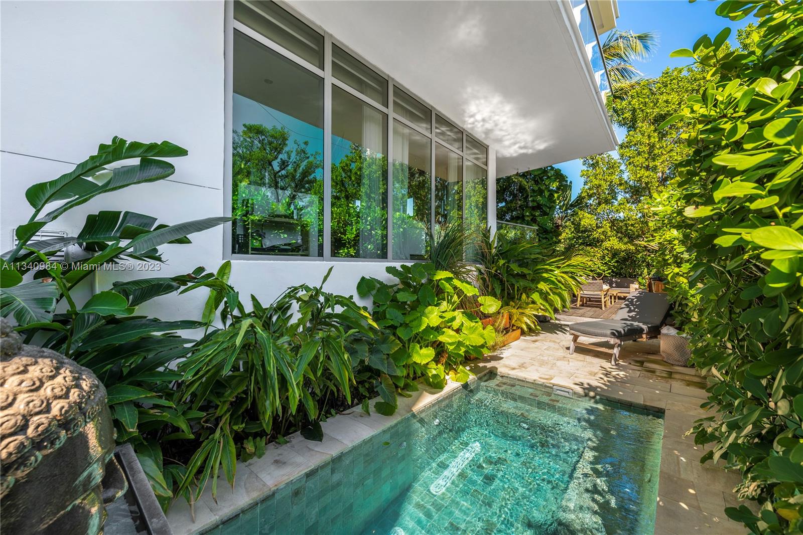 Rare, truly One of a Kind. Waterfront corner, Lanai unit at Sunset Harbour's premier address. A natural 3 bedroom that’s been transformed into a 2 bed but easy to revert. Tax Roll says 1,820 interior SF but measures larger. Architect owned with Duchateau Wood Floors, Italkraft Kitchen, Wolf, and Subzero Appliances. House ‘feel” with a useable covered 425sf Balcony AND step down to your own additional private 1,455 additional SF of beautifully landscaped private yard /garden with a Zen Plunge Pool. Full-service building, Library, Full Gym, 24-hour concierge, and 24-hour Valet. Best walkable neighborhood in South Beach, Award Winning restaurants, Fitness, and Shopping. Deeded Boat Slip, 30 + feet available valued at $350,000 (NOT in list price), but available.