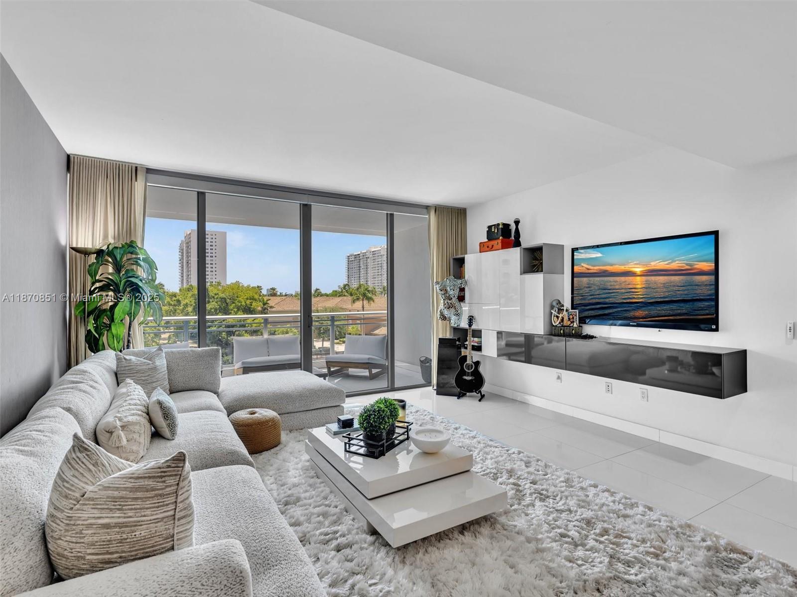 Welcome to this stunning two-story residence at Artech Residences in Aventura. Offering 1,552 sq ft, this waterfront condo features 2 bedrooms - each with ensuite bath and private balcony, plus an enclosed den on the first floor - ideal for a home office or playroom. Thoughtful upgrades include a waterfall-style counter, breakfast area, and glass-accented master bath. Artech provides resort-style amenities including two pools, hot tub, theater, state-of-the-art gym with yoga studio, racquet room, EV charging, and direct marina access. Conveniently located near top-rated schools, parks, Aventura Mall, and the Recreation Center, this home includes 2 parking spaces and extra storage.
