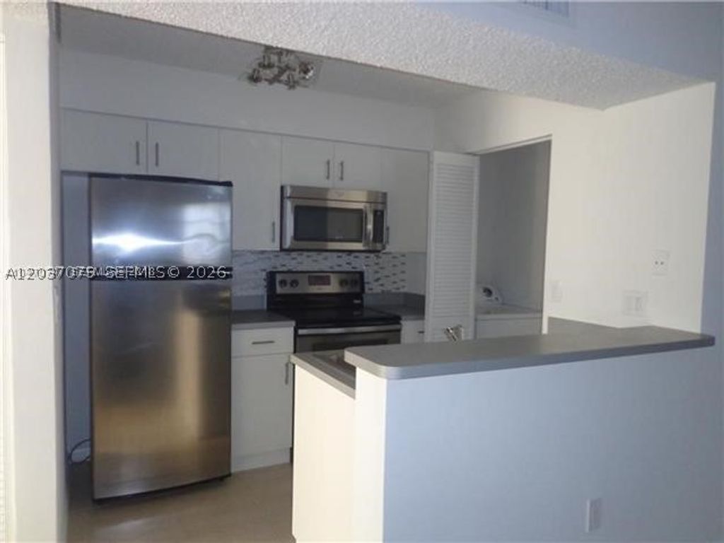 Photo of 1267 SW 46th Ave #2315, Pompano Beach, FL 33069 (MLS # A12037079)