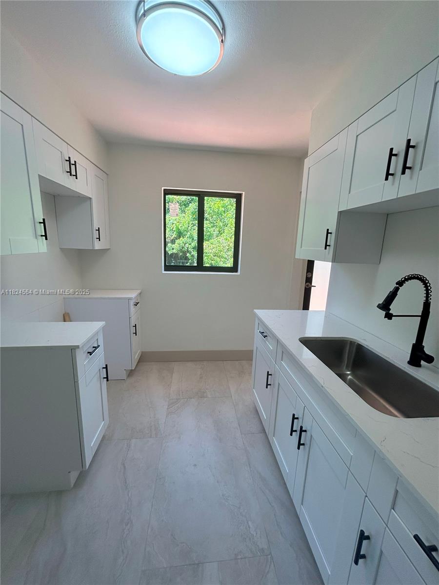 Welcome to 2971 NW 179th Street, a fully remodeled 3-bedroom, 1-bath beauty where modern luxury meets everyday comfort. Step through the door into a bright, open-concept layout bathed in natural light, featuring all-new stainless steel appliances, quartz countertops, soft-close cabinets. Kitchen is sleek, functional, and built for entertaining while the bathroom offers high-end tile and modern finishes. All details are luxury, from plumbing and electrical to HVAC, and impact windows, making this home solid and stylish. On an oversized 8,800 sq ft lot fenced backyard, there’s endless room for outdoor living or simply enjoying the Florida sun. Whether you're an investor or first time buyer, this turnkey property delivers space, security, and serious WOW factor. Don't miss your chance!