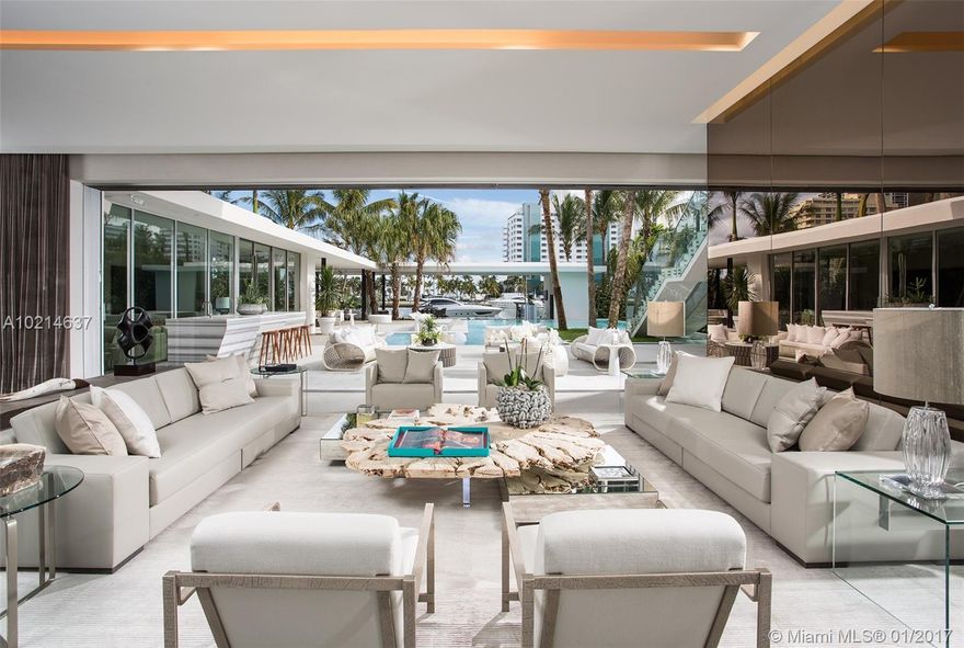 This architecturally distinct home located in one of the most exclusive neighborhoods in Miami Beach was conceived as a self-contained, multi-layered landscape of experiences which takes advantage of both Miami's tropical climate as well the Ocean and Miami Beach views. Elements of the home include stunning views of the Atlantic Ocean from the master bedroom, a waterslide concealed by an elegant glass staircase, a pool with open views and a boat dock that will be built to suit the buyers preferences.