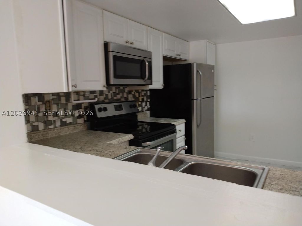 Photo of 805 SW 113th Way #805, Pembroke Pines, FL 33025 (MLS # A12036941)
