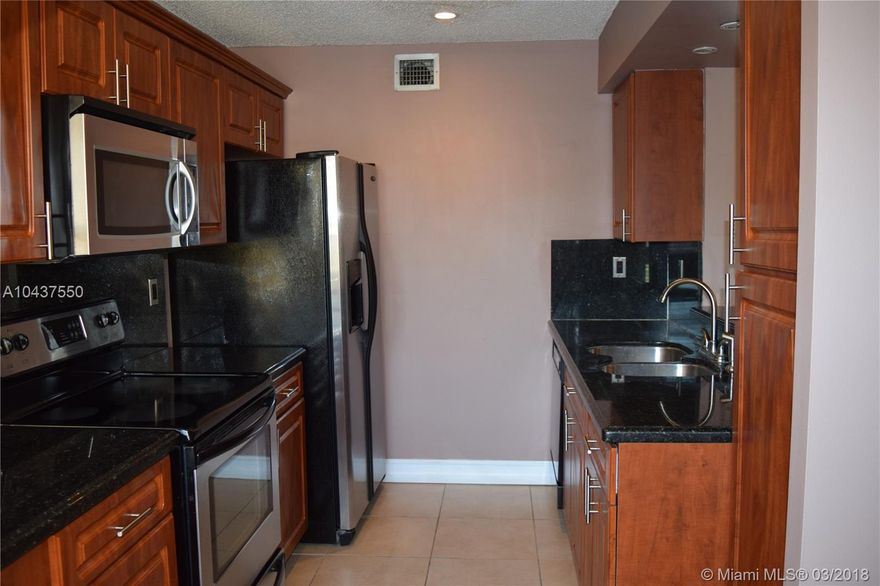 Completely updated and ready to move in. Beautiful Large 1 Bedroom 1 Bath with den/office.Tiled & Wooden floors throughout. High cathedral ceilings, kitchen has new appliances with black granite tops and dark wood cabinets, Built-In-Walk-in closets. Balcony with view to tennis courts.Walking dist. to Starbucks, Publix, Bus Stops,Restaurants and shops.