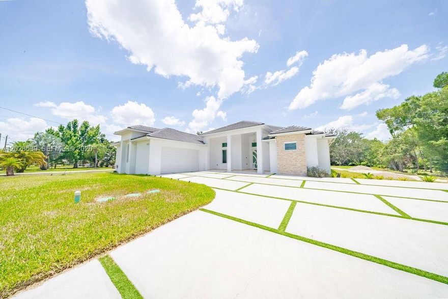 Built in 2025 on 1.14 acres in North Fort Myers, this custom home was designed for comfortable everyday living with quality construction and attention to detail throughout. Offering 4 bedrooms, 3 bathrooms, 2,324 square feet under air, and 3,734 total square feet, the home features high ceilings, abundant natural light, impact windows and doors, premium finishes, an upgraded potable well-water system, and a spacious floor plan that balances functionality with modern design. The outdoor kitchen creates the perfect space for entertaining, weekend gatherings, or simply enjoying Florida living year-round. With over an acre of land, there’s still plenty of room for a pool, detached garage, workshop, RV, boat, or your own backyard oasis. Conveniently located near shopping, dining, and everyday amenities while offering the space and privacy that acreage properties are known for.