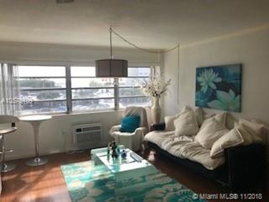 Waterfront fully furnished 1 bedroom 1 bathroom with water views! One block to the ocean- this one has it all including parking, laundry and waterfront pool. Beautiful unit with open kitchen w/both a dining table and barstools for comfort, dishwasher, microwave, electric range, full sized refrigerator, toaster oven, coffee maker, dishware and cookware. Spacious layout including wall to wall windows to bring in the view & fully appointed w/gorgeous furnishings including 2 flat screen TVs, updated bath accessible from living & bedroom areas & great closet space. Cable & internet included. Also avail for 6 months at $1800/m. Well kept quiet building w/lovely pool, great outdoor sunbathing & shaded areas, welcoming lobby w/elevators, 1 parking space included & additional available at $50/m.