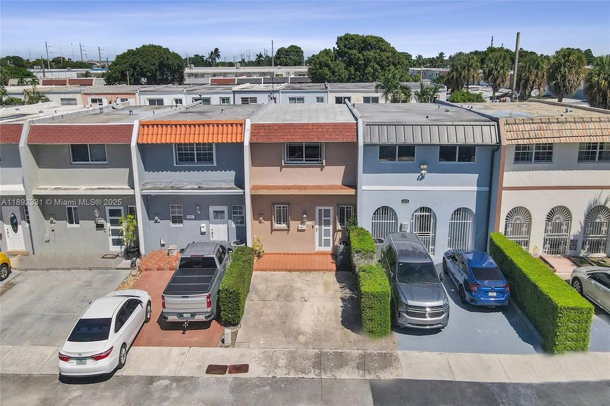 Elegant 2/2.5 townhouse in highly desirable West Hialeah, with NO HOA!! This beautifully maintained 2-story residence features 1,408sqft with 2 spacious bedrooms - both with private ensuite bathrooms - and tons of closet space! Porcelain tile floors on the ground level and modern laminate throughout the second floor. Open kitchen with breakfast counter overlooking livingroom / dining area for easy entertainment! Convenient half bath and dedicated laundry room located on the first floor. Private & fenced back yard, dedicated parking for 2 cars and accordion hurricane shutters throughout the property. New roof in 2020 + new A/C in 2021. Centrally located near shopping & dining, plus easy access to major expressways! Amazing value, move-in ready, will not last!!
