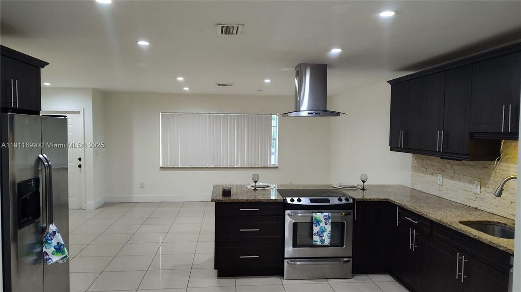 Photo of 118 Bobwhite Rd, Royal Palm Beach, FL 33411 (MLS # A11911899)