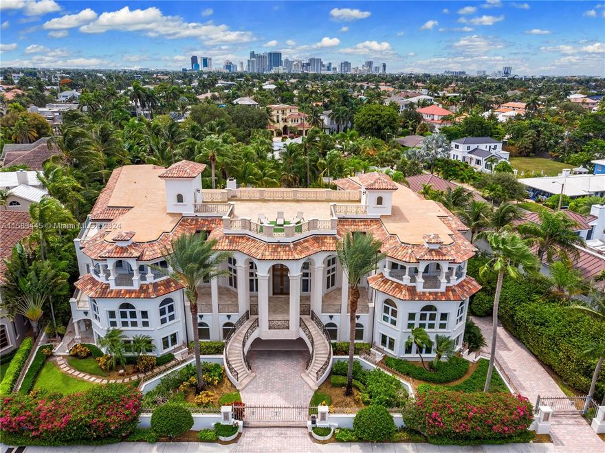Magnificent estate in the highly desirable Idlewyld neighborhood! This gated property affords sensational Intracoastal views w/mega yacht dockage. Upon arrival, you are greeted by a grand double staircase leading to a breathtaking great room. Features include theater, elevator, family & formal dining rooms, 2 offices, VIP guest suite & gym. Equipped w/security cameras, audio & alarm systems. Custom reimagined chef's kitchen w/La Cornue gas range, high-end appliances & marble countertops. Large main suite w/sitting area overlooking the Intracoastal, morning bar, bathroom w/dual vanities, water closets & walk-in closets. Rooftop terrace w/360 degree views of the ocean, Intracoastal & City. Private backyard w/heated pool, BBQ & cabana bath. Just minutes to Las Olas dining, shops & FTL Beach.