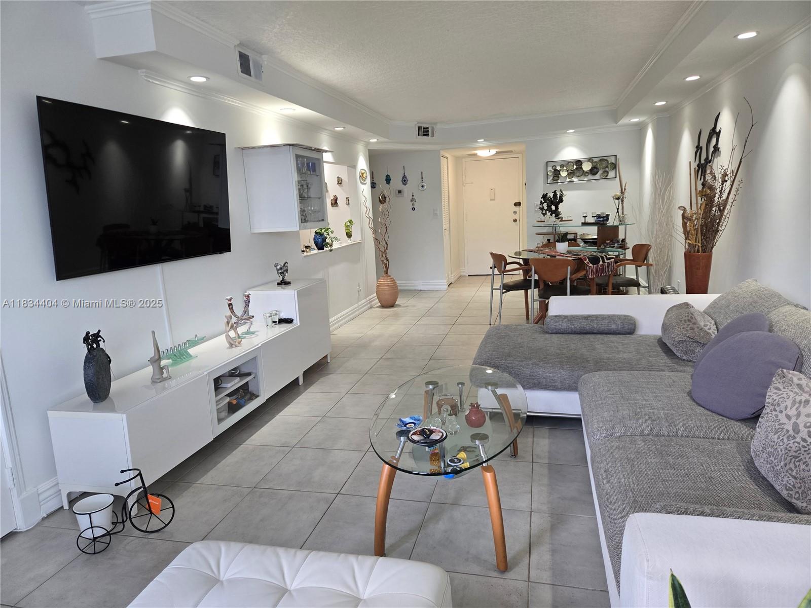 Enjoy the feel of a private home in this bright, first-floor unit with tile floors, floor-to-ceiling
windows, and extra closet space. Located in the heart of the desirable, gated Three Islands
community, just minutes from the beach, Aventura Mall, dining, casinos, houses of worship, and
major airports. Resort-style amenities include a waterfront pool, gym, sauna, BBQ area, tennis courts, clubhouse, courtesy bus, and 24/7 front desk security. Maintenance includes Wi-Fi, hot water,
and cable. Assigned parking + plenty of guest parking. Perfect for homeowners or investors – rent immediately after purchase. 40-year inspection complete. Credit score 700 and 25% down required.
A quiet, convenient location with everything nearby! A great place to call home or invest in!