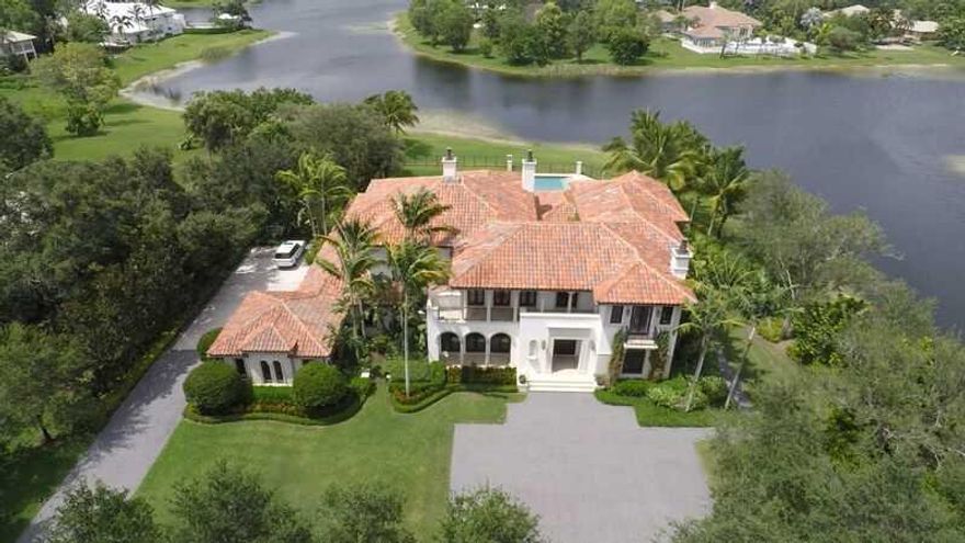 This contemporary-style home features imported mahogany,elaborate wood paneling,designer lighting,non-traditional wall treatments,three wood-burning fireplaces, impact windows & doors,fine window treatments,a wine room,custom office,elevator & laundry roo ms on each floor.As an entertainer's home,the residence features dual banquettes in the dining room,surround-sound speakers throughout & a entertainment room with an onyx countertop bar & billiards table.This palatial estate home is truly a masterpiece!