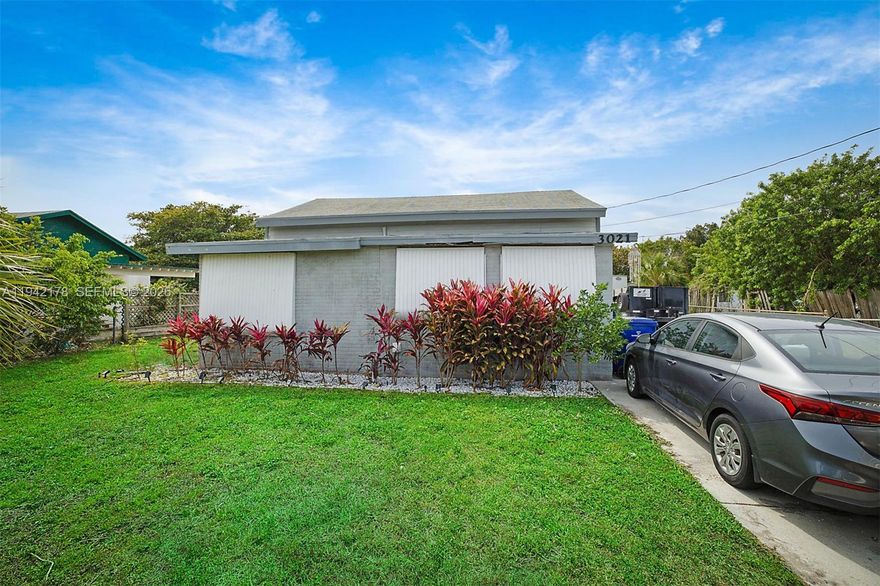 Discover this renovated home in Riviera Beach, Palm Beach County, ideally situated away from the busy beach area for a tranquil lifestyle. This completely remodeled residence features an inviting open-concept kitchen and living area, highlighted by elegant hardwood floors, fresh paint, and brand-new finishes throughout. The home offers two spacious bedrooms and two modern bathrooms, delivering both comfort and style. Set on a generous 7,150 sqft lot and zoned for multi-family use, the property presents the exciting potential to build an ADU for extra income. Embrace modern convenience, versatile design, and a serene setting in this exceptional, move-in-ready home. Call or text listing agent today to schedule a showing.