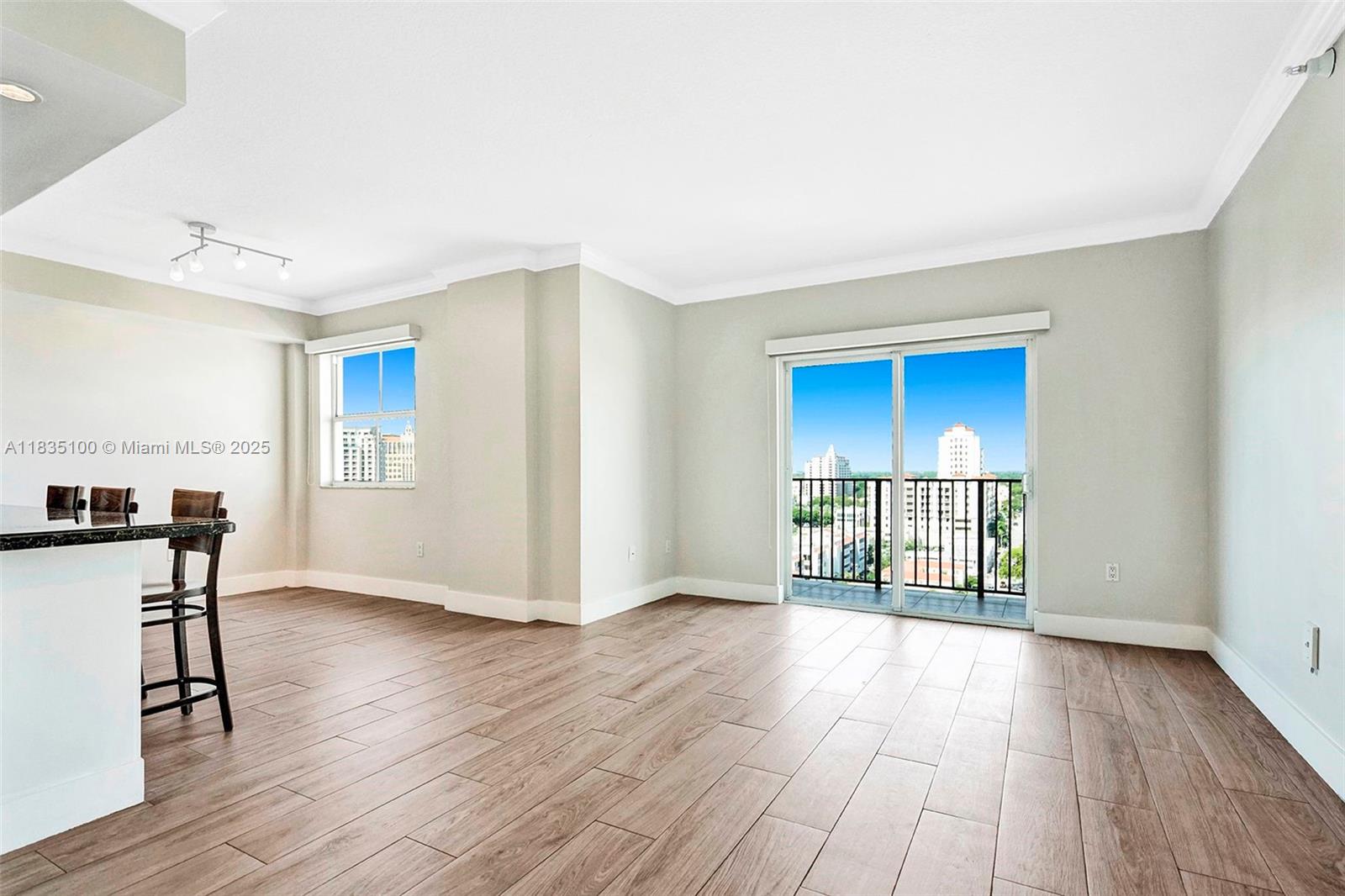 Vertical living at its best! Steps from Coral Gables in the heart of the Magic City, this 1/1.5 condo awaits to take your breath away with its stunning, endless views. Upgraded finishes complete with wood-like plank tile flooring, crown moldings, recessed lighting, motorized rolling shades in living areas & motorized blackout shades in bedroom, newer A/C system, double private balcony & washer/dryer in-unit. Around-the-clock security & fob entry system provides for secure & carefree living. Covered assigned parking, guest parking, storage unit, gym & pool to complete the amenities. Move-in ready! Pets welcomed! (1) at 25 lbs max. **NO SMOKING ALLOWED**