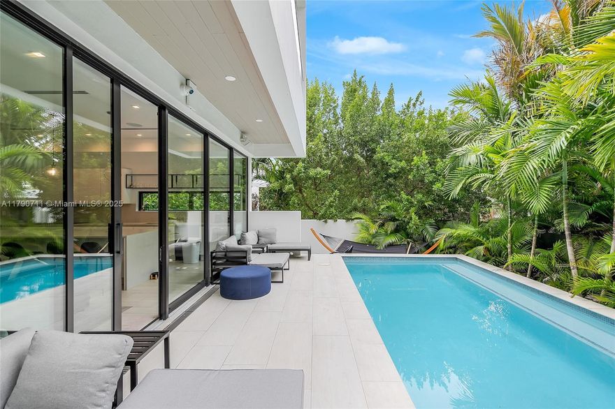 Beautiful ultra-modern home in exclusive Normandy Isles offers an unparalleled blend of luxurious waterfront living and welcoming tranquility. Nestled within the vibrant energy of Miami Beach, this enclave is surrounded by pristine waters of Biscayne Bay, providing residents with stunning views, direct access to boating, and the serenity of island-style living. The neighborhood's walkable layout, parks, and golf course make it perfect for families and outdoor enthusiasts. Plus, its proximity to world-class dining, shopping, and the cultural hotspots of Miami Beach ensure you're never far from the action while still enjoying a tranquil residential vibe. For those seeking a lifestyle that balances luxury, convenience, and relaxation, it's a destination that truly feels like home. Act now!