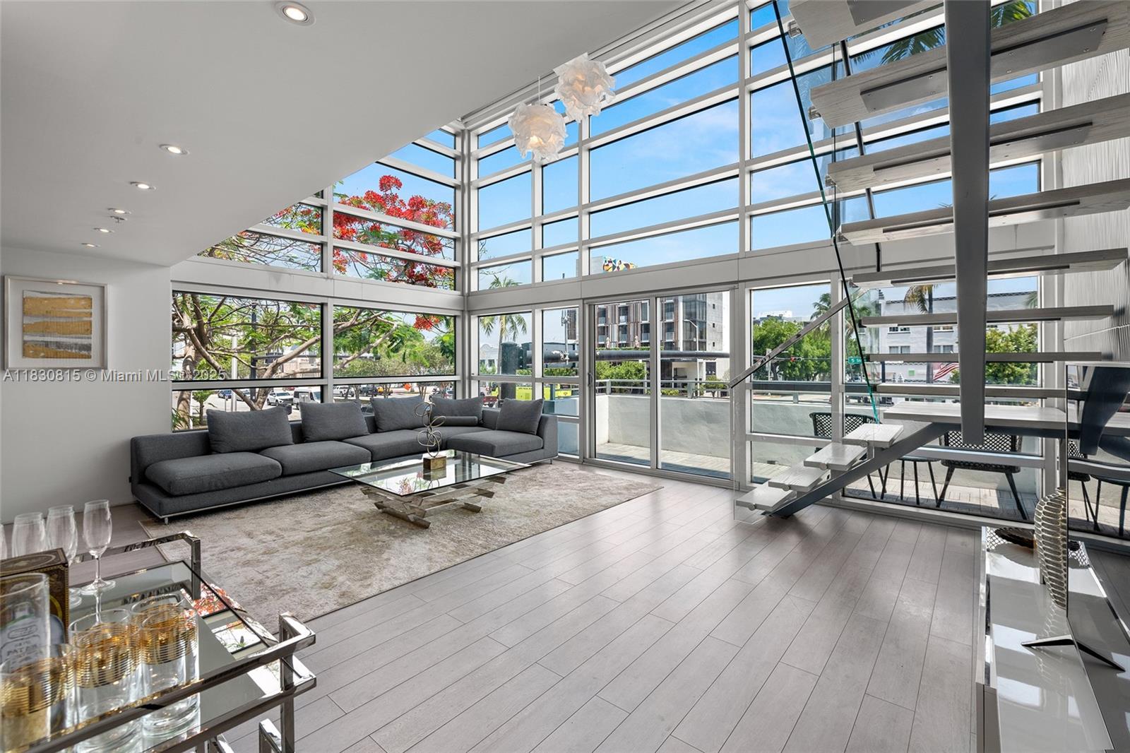 Boutique modern luxury furnished loft living South of 5th Street neighborhood located on tree lined Meridian Ave. Step into this movie star residence with 20 foot soaring ceilings and walls of windows & light. The stunning feature is the divine one of a kind staircase. First floor guest suite with spa inspired full bath. The latest up to the minute open-kitchen featuring stainless steel kitchen appliances and custom cabinets. In the unit- washer/dryer. Second floor master bedroom with walk in closet & world class bath all overlooking Miami Beach. The balcony is perfect for sunrise and sunsets. Amenities include: motorized window treatments, secured entry & beautiful pool. World-class dining, spectacular beaches, South Pointe Park are all within walking distance from this perfect location.