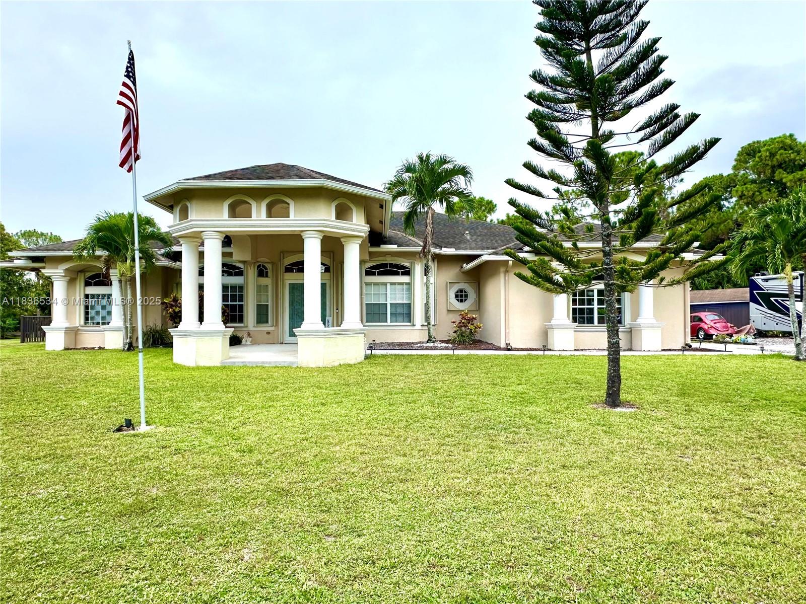 Beautiful house in the acreage with pool and lots of space to keep a boat and RV. High ceilings great layout with large rooms.