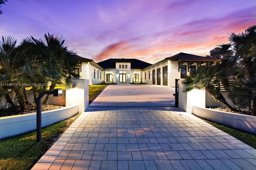 Welcome to this exquisite estate nestled within Horse Country featuring a blend of sophistication & practicality. Crafted in 2016 by an owner-developer, this property spans over 1 acre & boasts 10 beds & 9.5 baths across 10k sq’. It comprises 6 beds/6.5 baths in the main house, a detached 3 beds/2 baths in-laws, flow-thru 3-car garage & a 1,000 sq’ pavilion with summer kitchen, bathroom & flex space. Relish in a 700-bottle wine cellar, floor-to-ceiling marble baths, 24X48 limestone floors & 14’ ceilings. The elegant kitchen exudes sophistication featuring Thermador appliances, wood cabinetry & expansive island. Enjoy the spa-like primary suite, then immerse yourself in the outdoor oasis with a pool, Jacuzzi & tranquil surroundings. Features smart technology & a 75k KW generator.