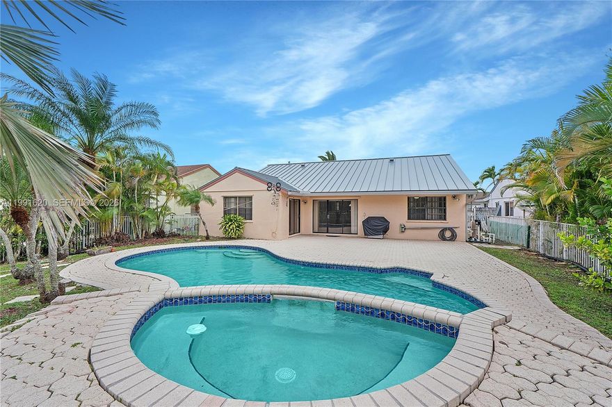 Beautifully maintained home with serene water views and a private backyard oasis featuring a POOL and SPA, perfectly designed for Florida living! Set in a desirable community, this residence offers curb appeal with a landscaped yard and a spacious 2-car garage * Inside, the home showcases high ceilings that enhance natural light and openness. The entire interior (incl. garage and garage floor) has been FRESHLY painted in April 2026! Exterior has been painted in 2025. Thoughtful upgrades include a brand-NEW durable metal ROOF, an updated electrical panel and exterior outlets, and a FULL replacement of the original polybutylene plumbing with modern PVC piping throughout the home, providing long-term peace of mind * The kitchen is equipped with stone counter tops and NEW appliances and offers functionality for everyday cooking and entertaining, while abundant storage throughout the home adds convenience * Step outside to your private tropical retreat, featuring a fully FENCE backyard with mature fruit trees including mango, banana, and green peas, all surrounding the POOL and SPA area with tranquil water views * With a low HOA, X-flood zone (no flood insurance required) and a combination of major system upgrades and outdoor lifestyle features, this home presents a rare opportunity to enjoy the best of Florida living. Schedule your private showing today!