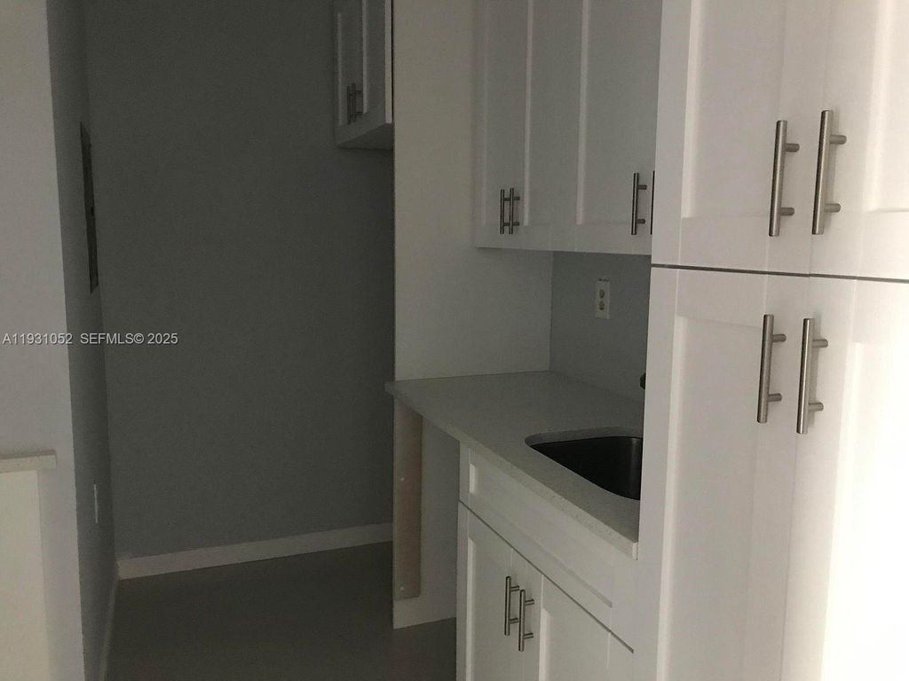 Photo of 1133 N Benoist Farms Rd #103, West Palm Beach, FL 33411 (MLS # A11931052)