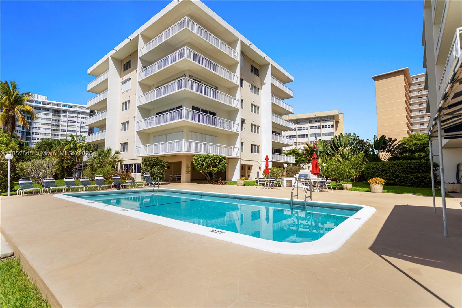 Spectacular waterfront corner 2/2 on Golden Isles Bay w/ocean access & marina. Wrap-around balcony w/panoramic water views. Open gourmet kitchen w/quartz waterfall island, white shaker cabinets, backsplash & new SS appliances. Wood floors, walk-in closets, large pantry, high-impact windows. Amenities: heated pool, BBQ, entertaining area, 2 storage units, and free laundry facilities next to the unit. 40-year inspection passed. Walk to beach, shops, dining. Dock up to 48’ boat ($3.50/ft, waitlist). No rentals. Easy to show.