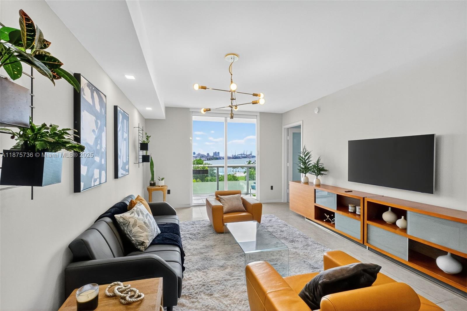 Stunning fully furnished 1BR + den/1BA, tastefully renovated and professionally decorated with sweeping Biscayne Bay water views and Bayfront Park views in the heart of Downtown Miami. Turnkey unit with open kitchen and stainless appliances, quartz counters and oversized windows that flood the space with light. Versatile den functions as a home office and includes a Murphy bed for guests. Parking located on the same floor for more convenience. Residents enjoy resort-style amenities: pool with hot tub & cabanas (open until 10pm), attended spa, fitness center with complimentary yoga & pilates classes, game room, concierge, Amazon locker room and 5 Tesla EV chargers. Steps to Whole Foods, the renovated Flagler St dining & shops, Bayfront park and cultural venues for a perfect lifestyle
