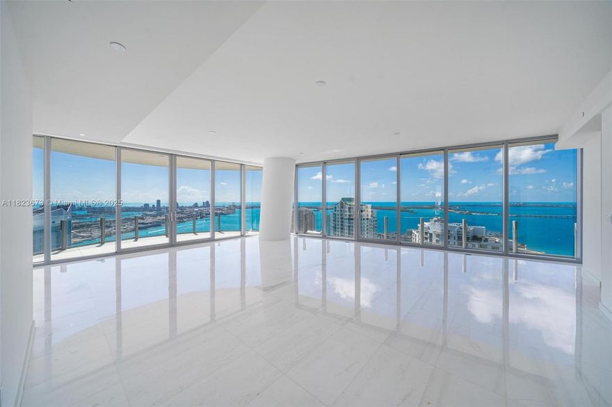 Step into elevated luxury at Residence 4301, a coveted corner unit in the iconic Aston Martin Residences. This expansive 5-bedroom, 5.5-bathroom home features one of the largest floor plans in the building, with sweeping views of Biscayne Bay and the Miami skyline from every angle. Floor-to-ceiling windows flood the space with natural light, while the chef’s kitchen is outfitted with Gaggenau appliances and a walk-in pantry. The wraparound terrace offers the perfect setting for entertaining, and the primary suite includes dual spa-like bathrooms and a massive walk-in closet. Residents enjoy 43,000 SF of amenities, including a sky pool, full-service spa, two-story fitness center, and more—seamlessly blending comfort, sophistication, and Aston Martin’s signature style.