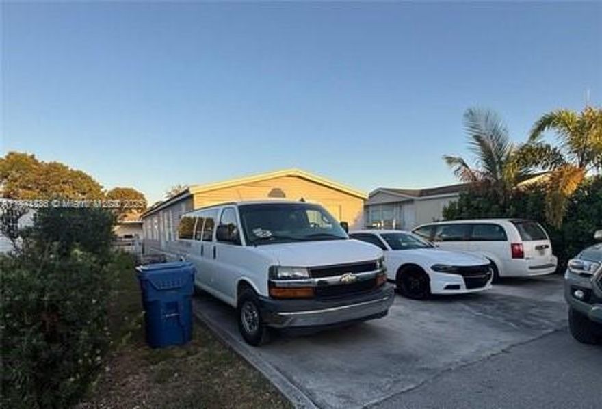 Renovated home in the gated community of Americana Village. Plenty of parking. You own the land here. Gated property with updated bathrooms, laundry room and kitchen. This is a gated community with multiple pools, basketball courts, kids play park and management at site. Land is included and low association of $179