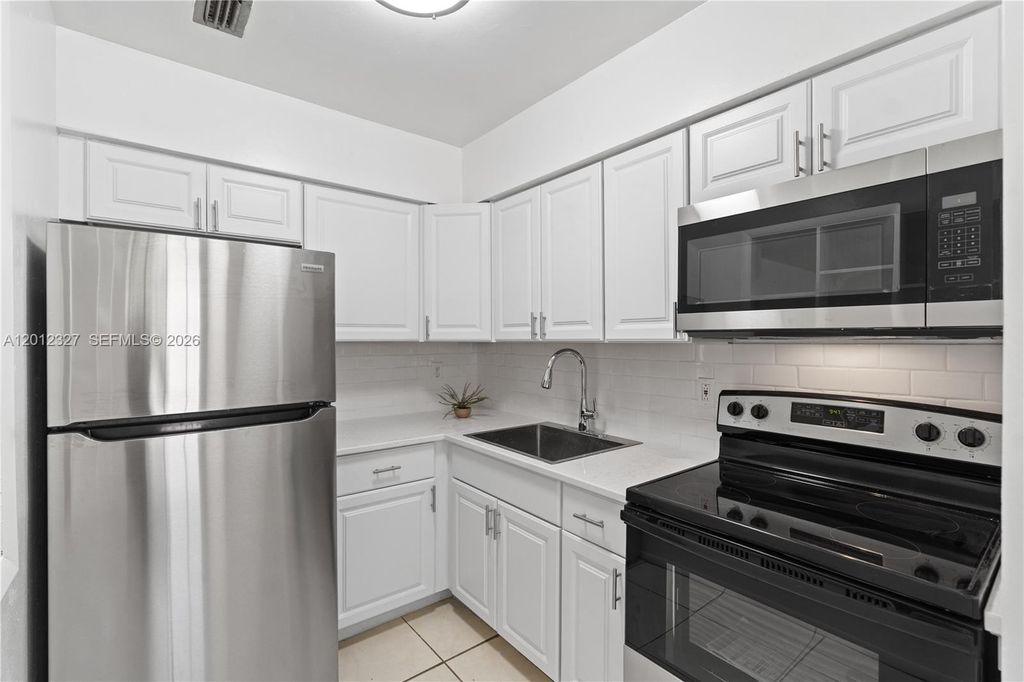 Photo of 2325 NW 52nd Ct #2325, Fort Lauderdale, FL 33309 (MLS # A12012327)