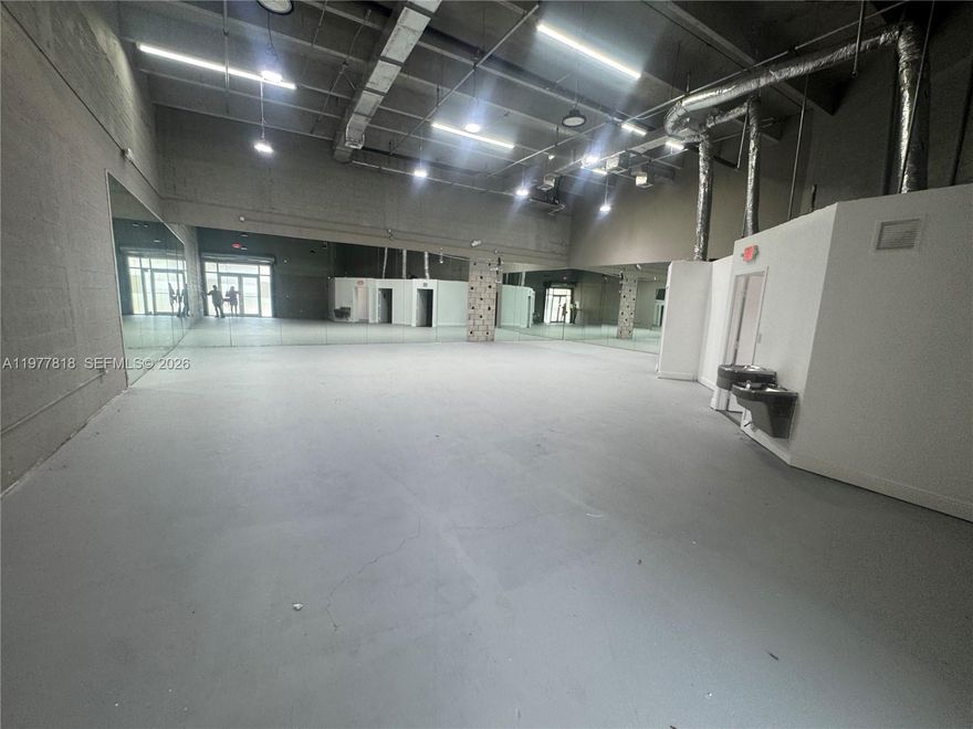 rime 2,651 sq. ft. office-warehouse unit located in the heart of Doral’s busy commercial district. This versatile space offers street-level access, a large open air-conditioned warehouse area, and a dedicated office component, making it ideal for a wide range of uses, including light manufacturing, distribution, e-commerce operations, showroom space, or professional services.

The flexible layout allows businesses to easily adapt the space to their operational needs while maintaining a comfortable working environment. Located just minutes from major highways and Miami International Airport, the property provides excellent connectivity for logistics, employees, and clients.

A great opportunity to secure a turnkey industrial space in one of Doral’s most sought-after business locations. Immediate occupancy.