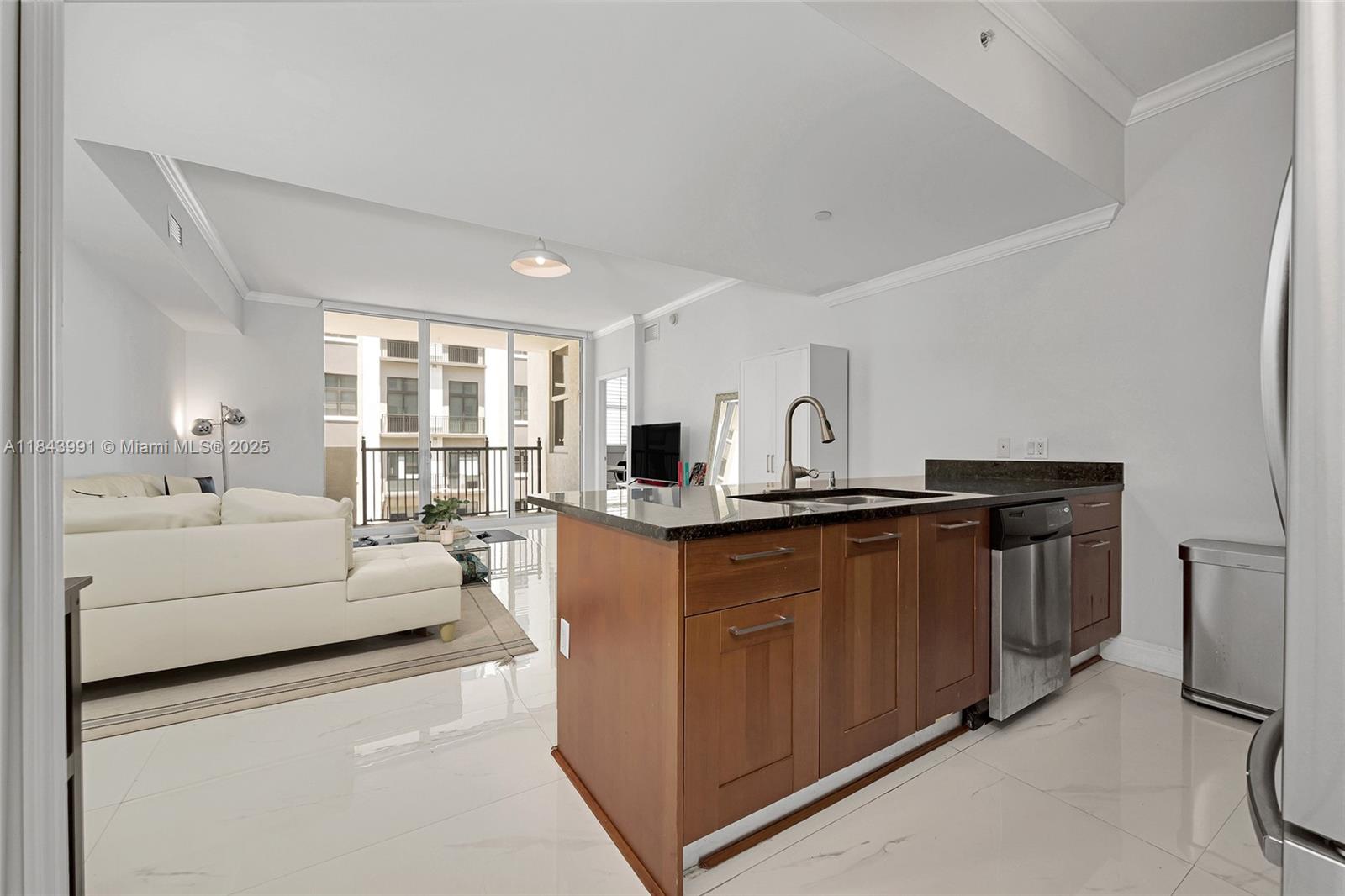 This fully furnished spacious 2-bdrm, 2-bath condo at One Village Place has great views & comes with 2 Parking Spaces, which is rare in this building. Located on the 5th floor, it overlooks a walkway, parts of downtown Coral Gables & more. Features porcelain tile floors, lots of natural light, in-unit washer/dryer & a cozy balcony—perfect for relaxing. Just steps from the Shops at Merrick Park, restaurants, cafés, & close to US-1, Miracle Mile, & the University of Miami, this condo offers top convenience. The building features 24-hr security, on-site management, a gym, conference room, jogging path, pool, covered parking, guest parking, & is pet-friendly. Schedule your private tour today & make this your new home in one of Coral Gables' most desirable buildings. Students welcome!
