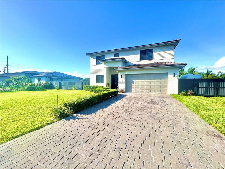 Welcome to this elegant two-story residence offering 5 bedrooms and 4.5 bathrooms, designed with comfort and flexibility in mind. One of the bedrooms can easily be converted into an efficiency with a private entrance, providing the perfect setup for guests, extended family, or rental income potential. This home features an open-concept layout with abundant natural light, a spacious living area, and a modern kitchen ideal for entertaining. Additional highlights include impact-resistant windows and doors, a two-car garage, paved driveway, and ample outdoor space ready to accommodate gatherings or future upgrades. With its versatile design and prime location, this property offers the perfect blend of functionality, style, and investment opportunity.