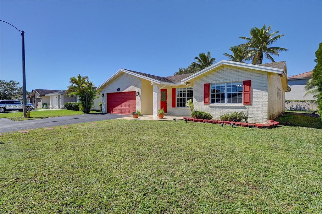 Photo of 8301 NW 98th Ave, Tamarac, FL 33321 (MLS # A11537071)