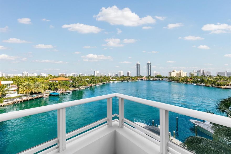 Impeccable, entirely brand new interior — nothing else similar in the building. Pristine 3 bed, 3.5 bath home situated on a rare waterfront corner where residents enjoy unobstructed views of Surprise Lake from the expansive balcony. Private elevator foyer leads to 14' ceilings showcasing nearly $1M upgrades. Custom millwork, floor-to-ceiling windows & full Lutron lighting package w/dimmers illuminate the home. Features include: Lualdi solid core doors, fixtures, + hinge-less systems, high-efficiency A/C, low-profile linear diffused ductwork. Large kitchen w/ imported Italian black marble island, Boffi cabinetry, Gaggenau appliances, & Zucchetti fixtures. Primary + guest suites: Dornbracht plumbing fixtures, imported Italian closet systems, bronze reflective glass, & incredible storage.