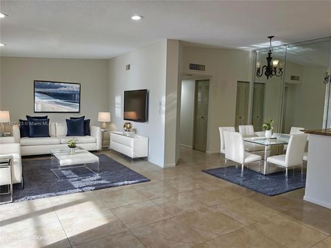 Photo of 9873 N Belfort Cir #215, Tamarac, FL 33321 (MLS # A11807723)