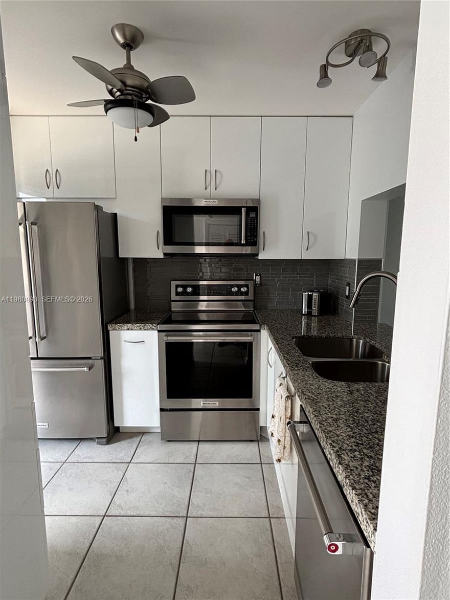 ** Come and make this home** Enjou this completely remodeled modern contemporary style 1 bedroom, 2 baths first floor beauty** You'll love parking right by your front door and having the beach just steps away across the street** No expenses spared from the kitchen to the flooring and more...** Move right in as this one can be rented completely furnished** All ages welcome.**  Available May 1 st.**