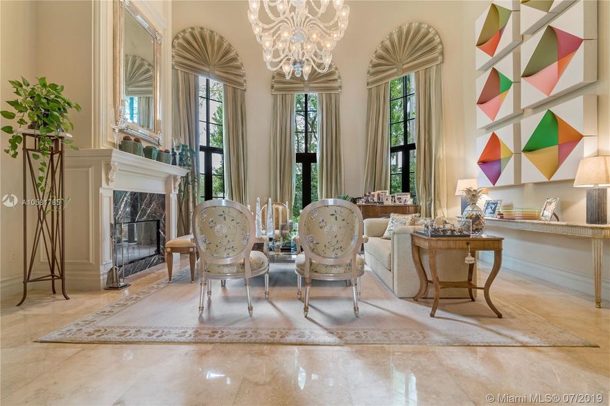 This 7 bedroom, 7 bath and 2 half baths, 1 acre estate is located on a quiet cul de sac street in Ponce/Davis area. The property is filled with mature trees, breathtaking landscape, and a tremendous backyard. This magnificent home has a beautiful entry, stairway, dining room, library, guest suite, family room, game/media center, staff quarters, master suite with his and her bathrooms, secondary media room and a 3 car garage. Beautiful features throughout such as custom wood cabinetry, crown moldings, marble flooring, impact glass and hand forged railings.